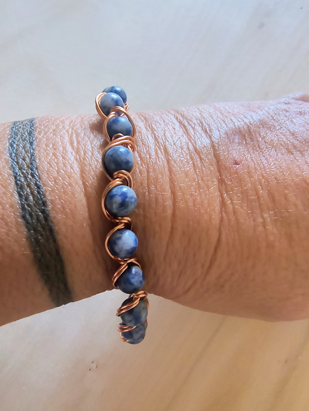 Hand Crafted Blue Bead Bracelet with Copper Wire Wrap